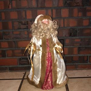 A Christmas tree Santa topper